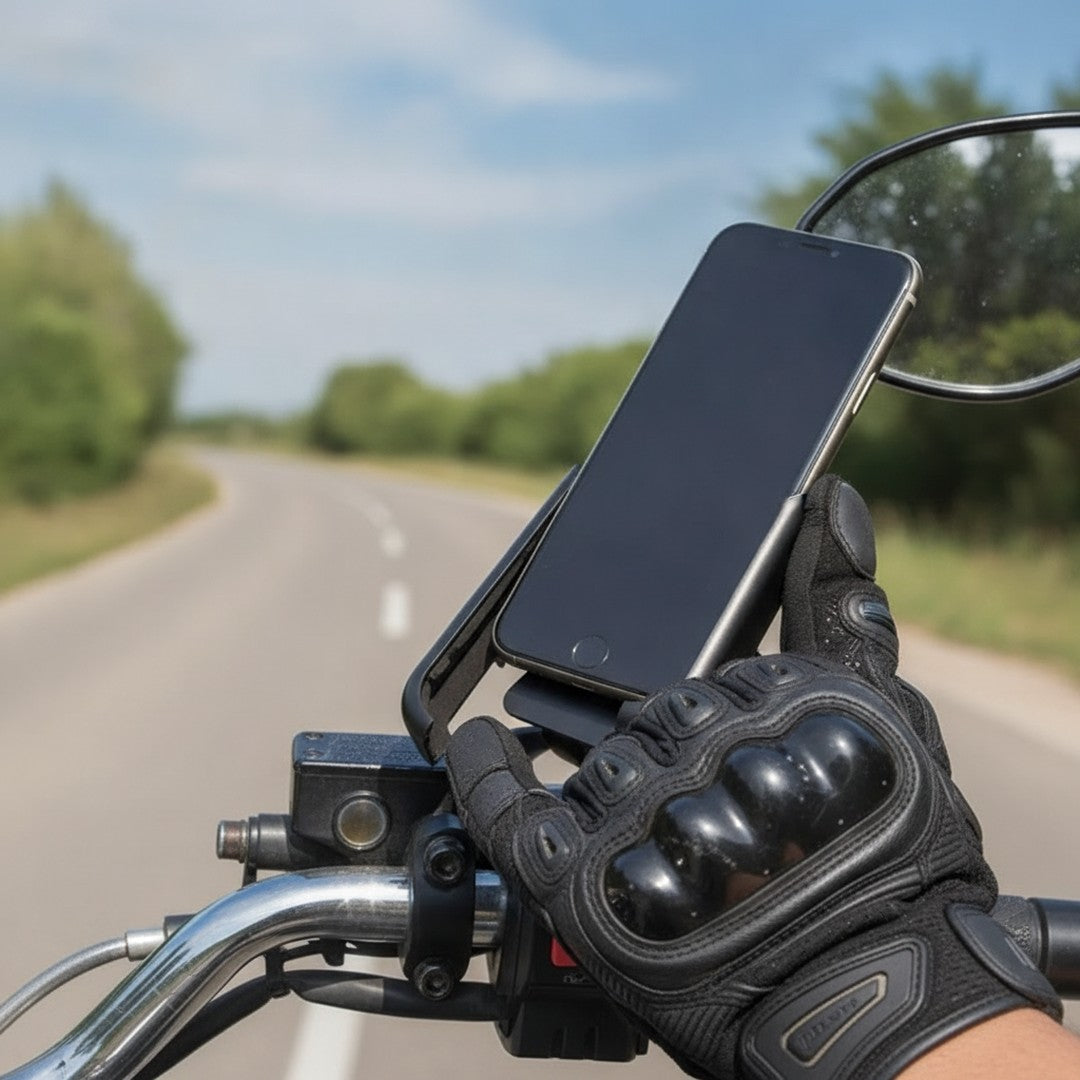 Gloved hand securing a phone in a motorcycle phone mount