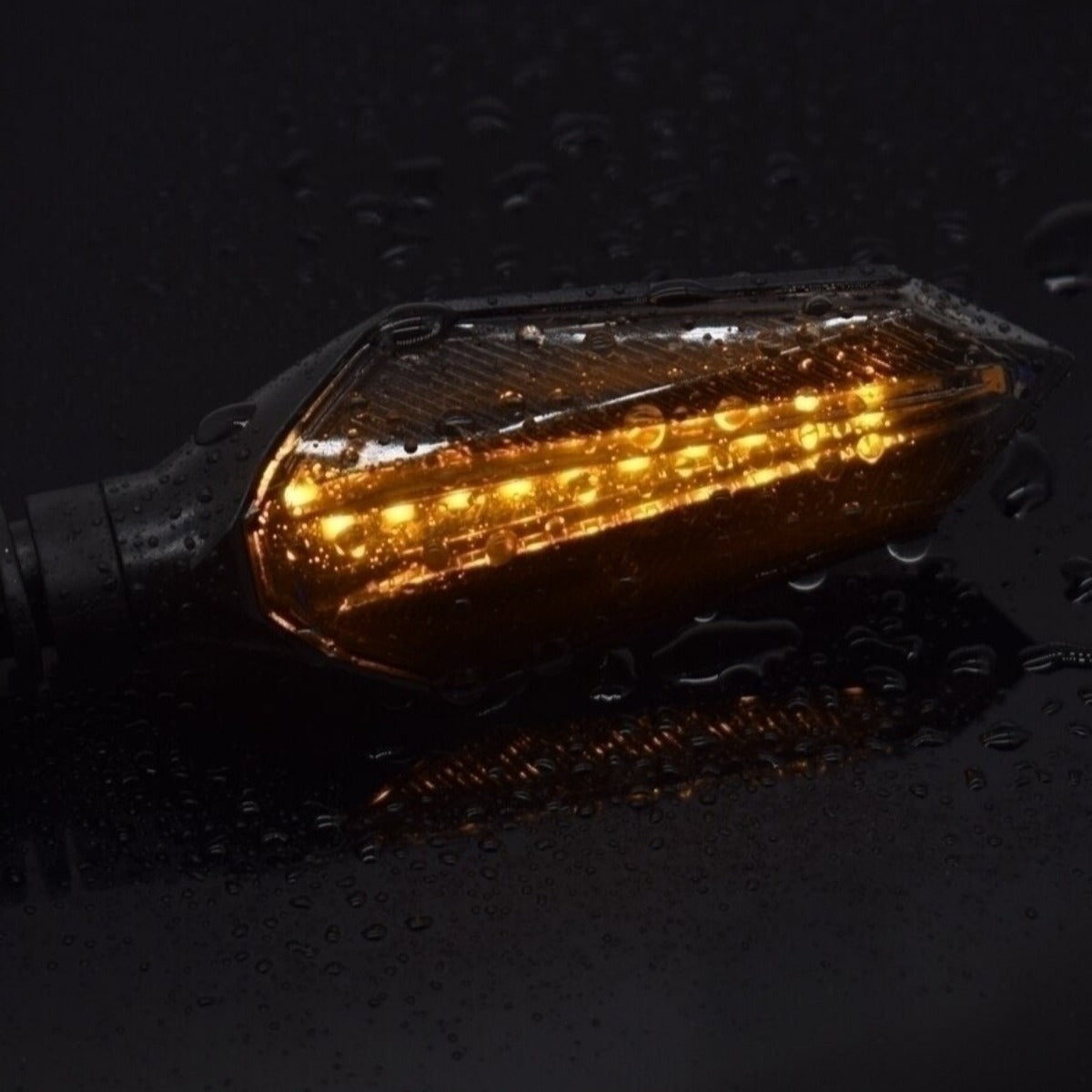 A Universal Motorcycle LED Turn Signal Sequential Flow, providing safety with its sequential flow, illuminates on a sleek black background.