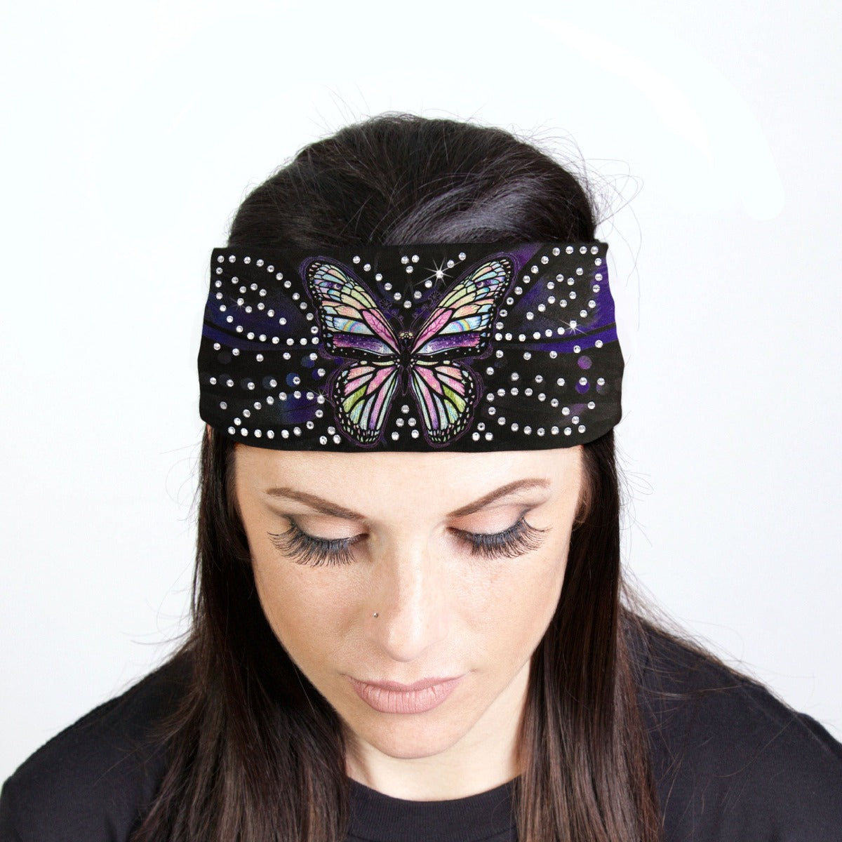 A woman with a Hot Leathers Butterfly Bandana Headband Wrap w/Rhinestones adorned with rhinestone crystals in a butterfly design.