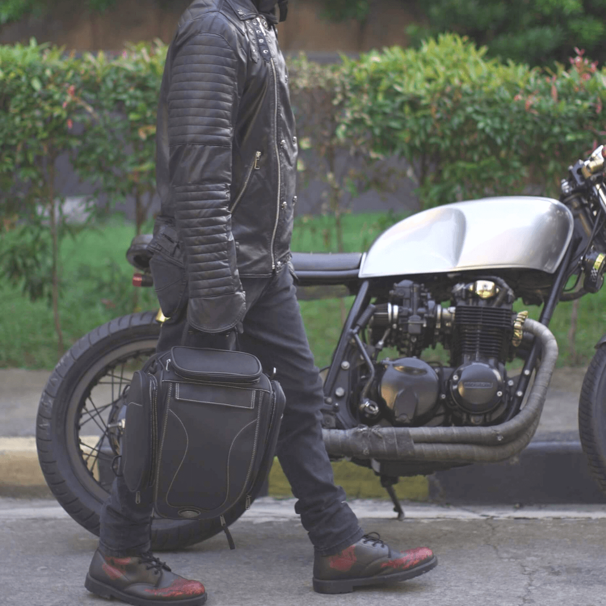 The man is wearing a Universal Motorcycle Retro Tail Bag with Waterproof Cover.
