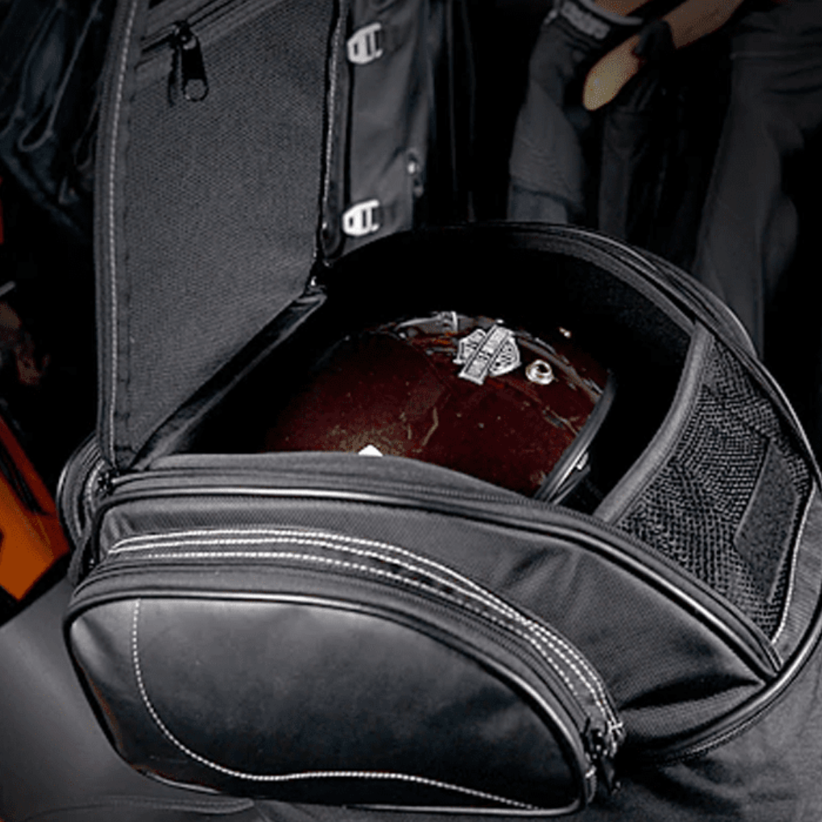 This versatile Universal Motorcycle Retro Tail Bag with Waterproof Cover by Harley-Davidson is made of waterproof leather and fiber material. It features a retro motorcycle tail bag design.
