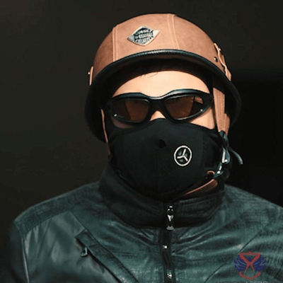 A man wearing Classic Daisy Biker Motorcycle Sunglasses and a helmet OR A man wearing biker glasses and a face mask for protection.