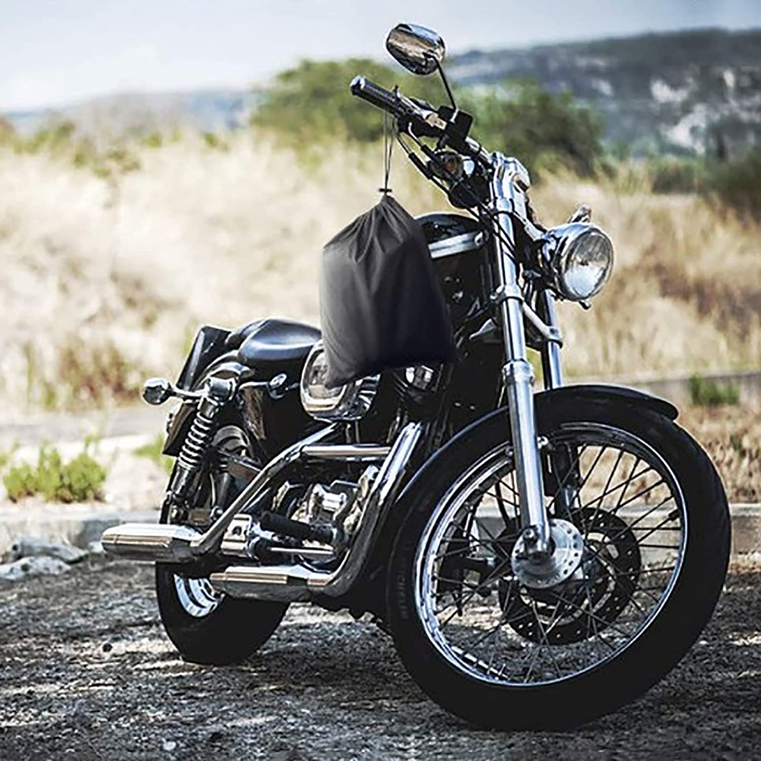 A Waterproof Motorcycle Cover, parked on a dirt road.
