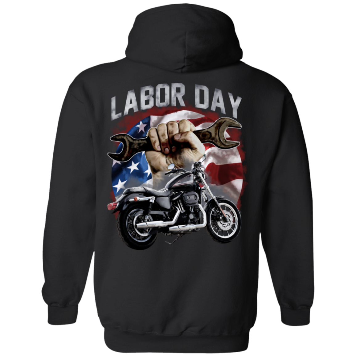 The Labor Day Hoodie boasts a striking design showcasing a hand gripping a wrench, a motorcycle, and an American flag in the background. Crafted from a cozy cotton/polyester blend and featuring unisex sizing, this hoodie is ideal for anyone looking to celebrate their holiday spirit in style.