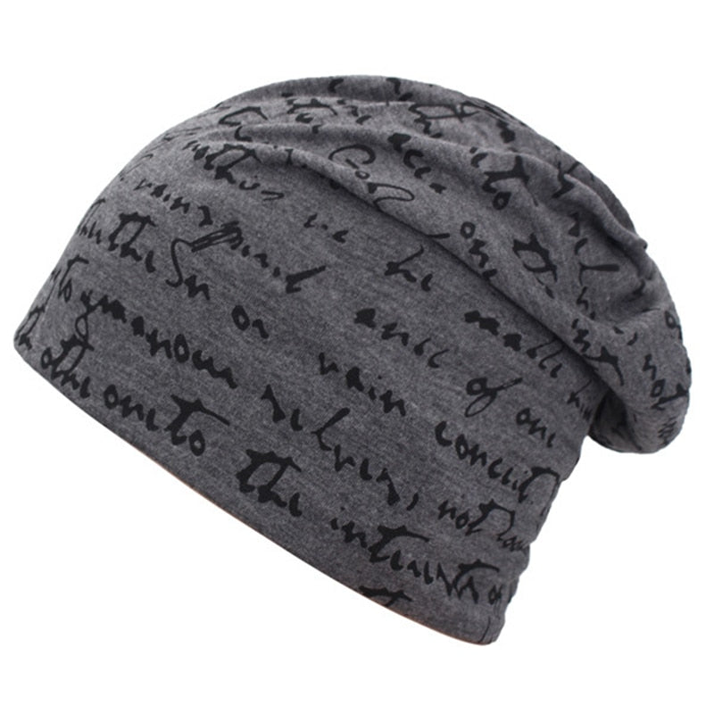 A Fashionable Printed Beanie Hat with black writing on it made of cotton, perfect for casual wear.