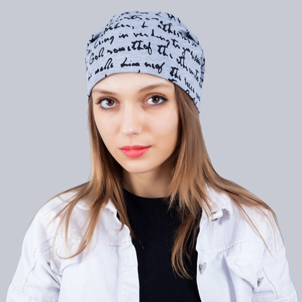A fashionable woman wearing a Fashionable Printed Beanie Hat.