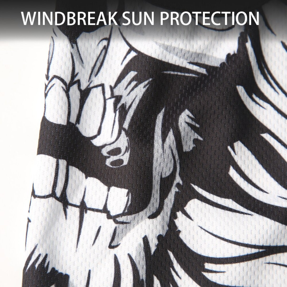 Close-up of a fabric with a black and white skull design, perfect for use as a Skull Balaclava Full Face Mask during skiing, snowboarding, or motorcycle rides. The text "WINDREAK SUN PROTECTION" is prominently displayed at the top.