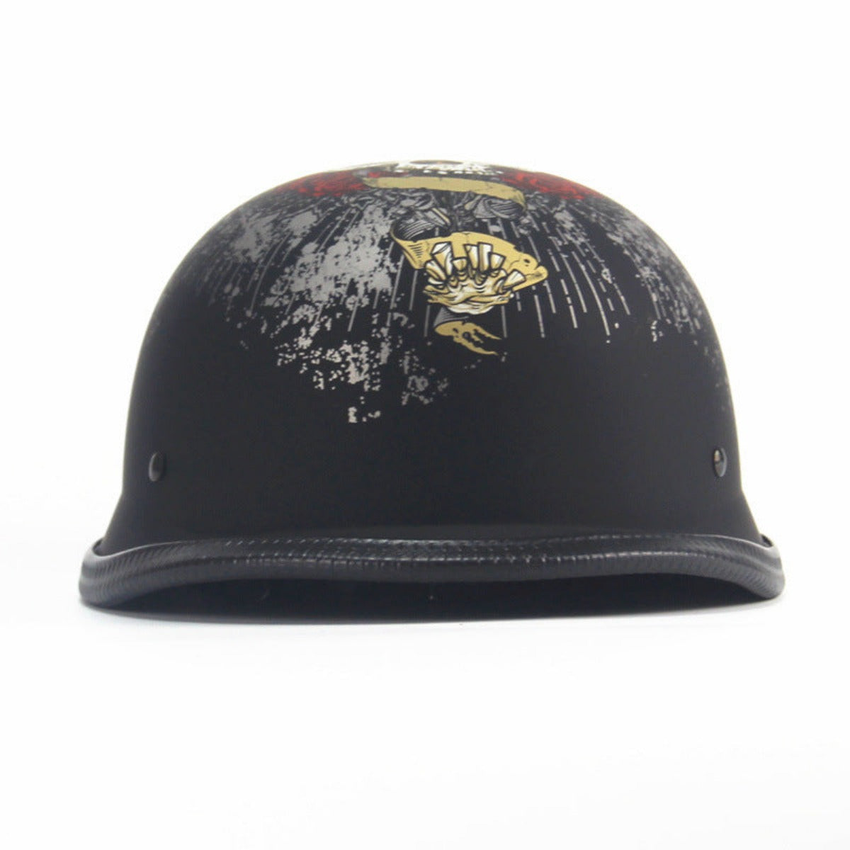 The Skull Cap Motorcycle Helmet in matte black showcases a captivating graphic design on the front, accentuated with gold and white detailing. DOT Approved for safety, it includes two ventilation holes on each side to ensure optimal airflow.