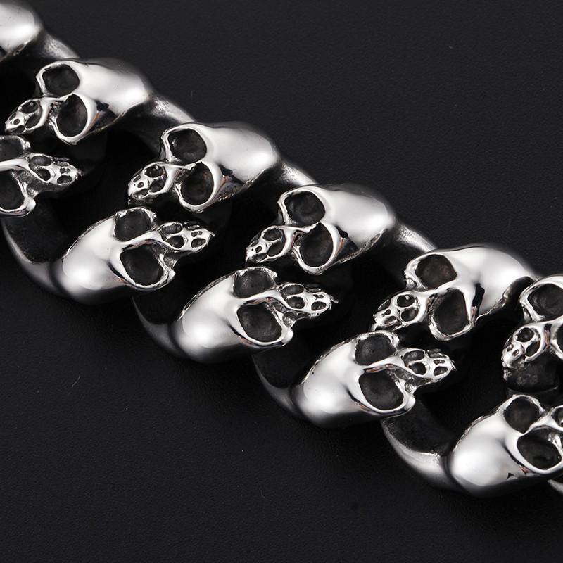 A Stainless Steel Men's Punk Skull Bracelet, Silver with skulls on it.
