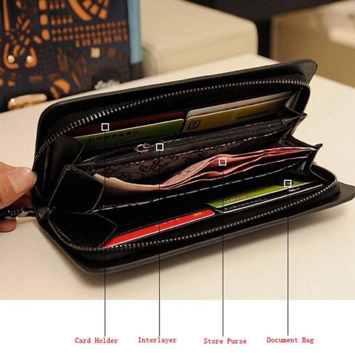 A person is holding a Vintage Skull Wallet with different compartments.