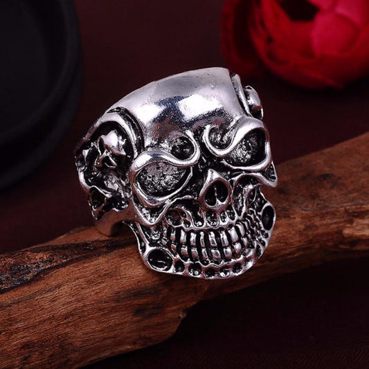 A Punk Ring on top of a piece of wood.