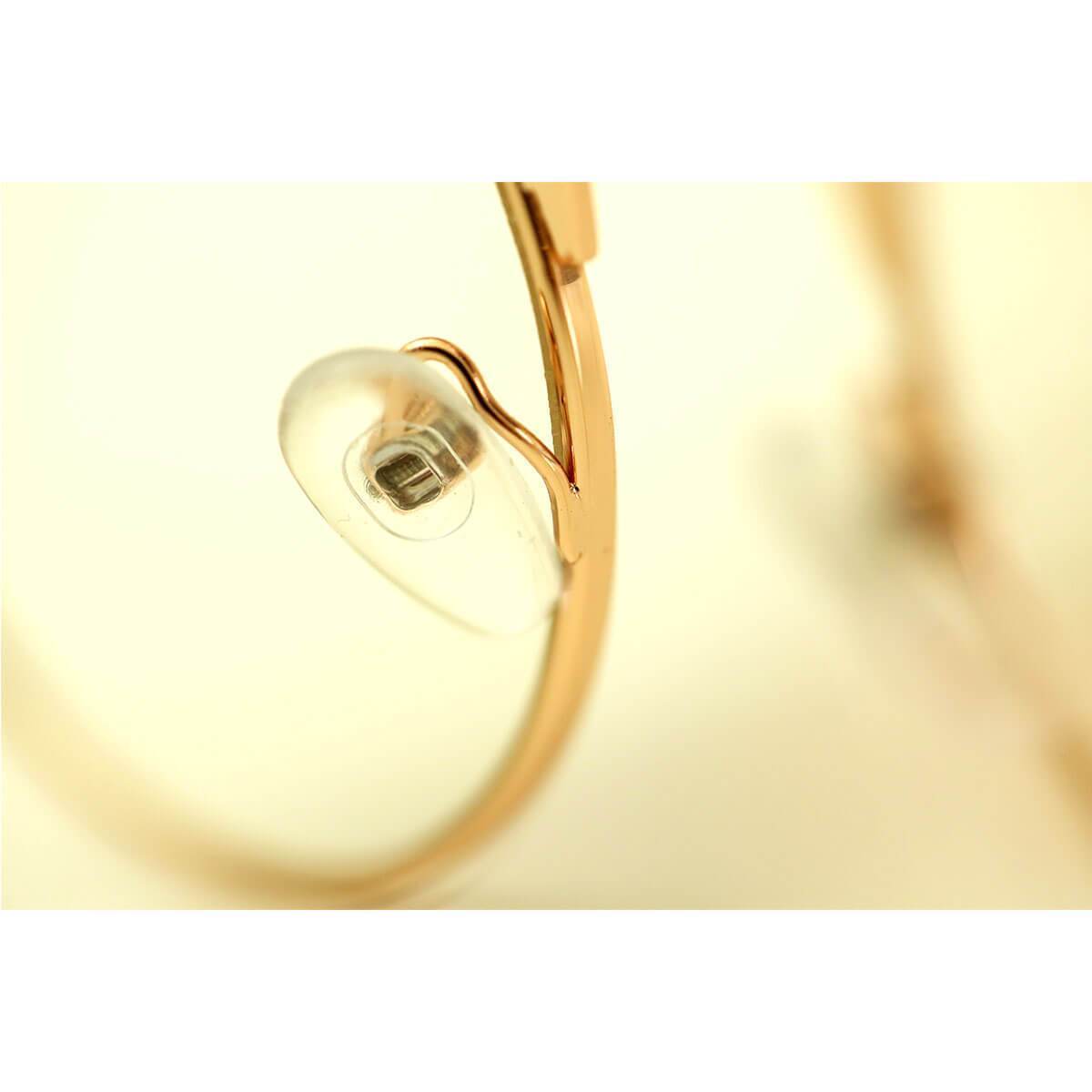A close up of a pair of Steampunk Flip-Up Round Double Lens Sunglasses on a white surface.