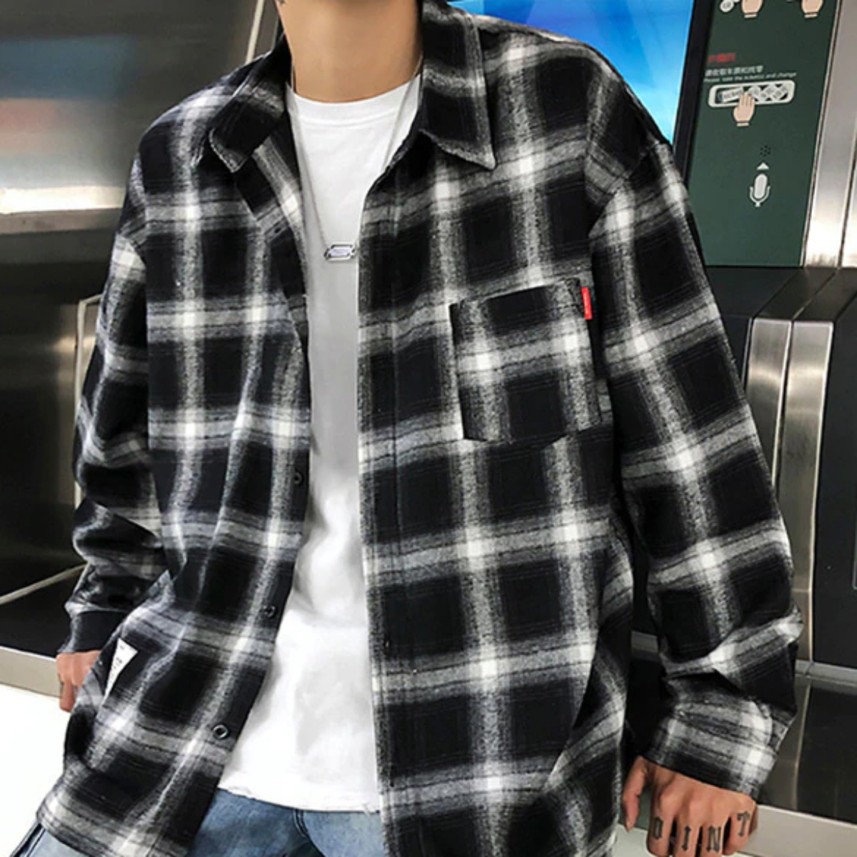An American Legend Ride enthusiast dons a Men's Classic Plaid Flannel Shirt, Black/White, exuding timeless appeal with his plaid attire.