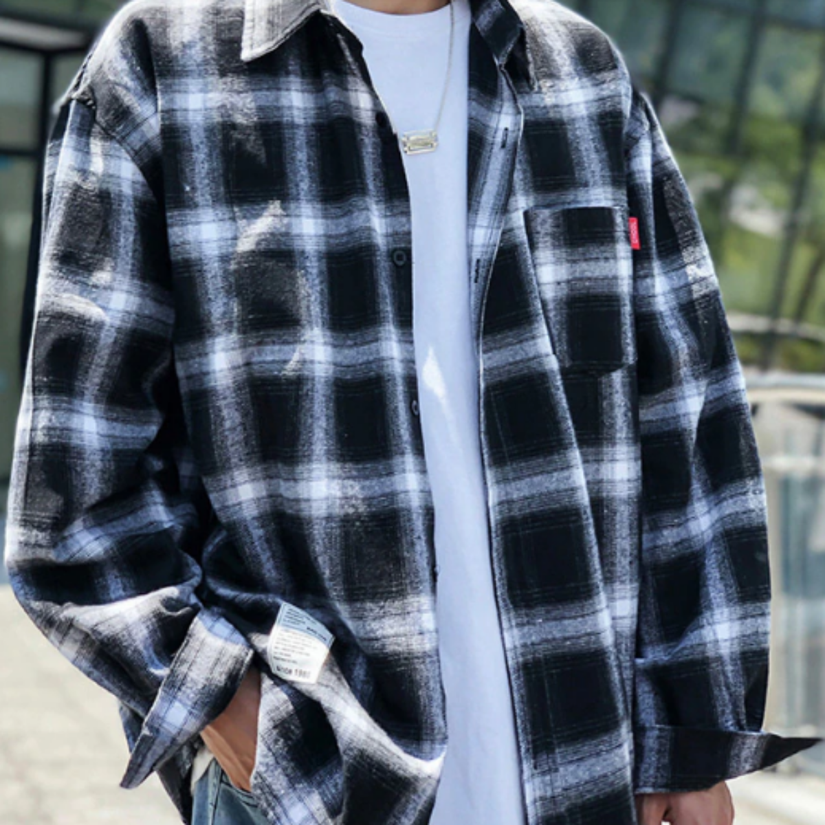 A man wearing a Men's Classic Plaid Flannel Shirt, Black/White.