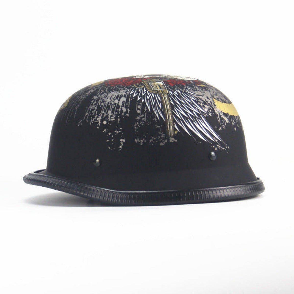 The Skull Cap Motorcycle Helmet in Matte Black is DOT Approved and features graphic wing and cross designs, with small metallic rivets and a textured edge.