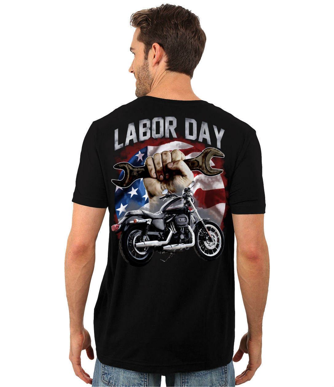 A man wearing the Labor Day T-Shirt, a black heavyweight classic unisex tee featuring a "Labor Day" design on the back with an American flag, a fist holding a wrench, and a motorcycle. Made from a comfortable cotton/poly blend and brought to life with vibrant digital print.