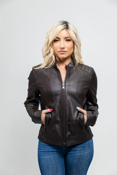 A woman wearing a First Manufacturing Beverly - Women's Vegan Leather Jacket, Brown style fashion jacket.