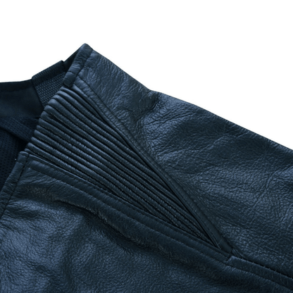 A close-up of the Vance Zip-Out Insulation Pant Style Motorcycle Leather Chaps displays a section of the leather along with the detailed textured stitching, highlighting its zip-out insulation for added versatility.
