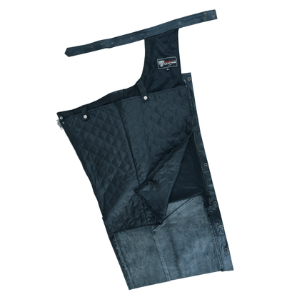 The Vance Zip-Out Insulation Pant Style Motorcycle Leather Chaps feature quilted fabric leg aprons with adjustable straps, ideal for outdoor activities and riding. The chaps are displayed flat, showcasing both the inner and outer layers and include a zip-out insulation to provide customizable warmth.