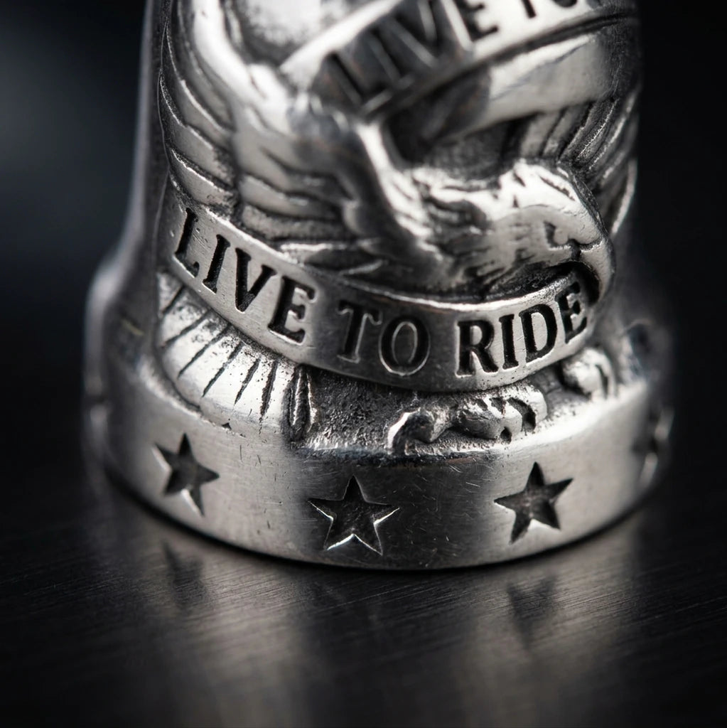 Close up of silver eagle design on Live to Ride ride bell