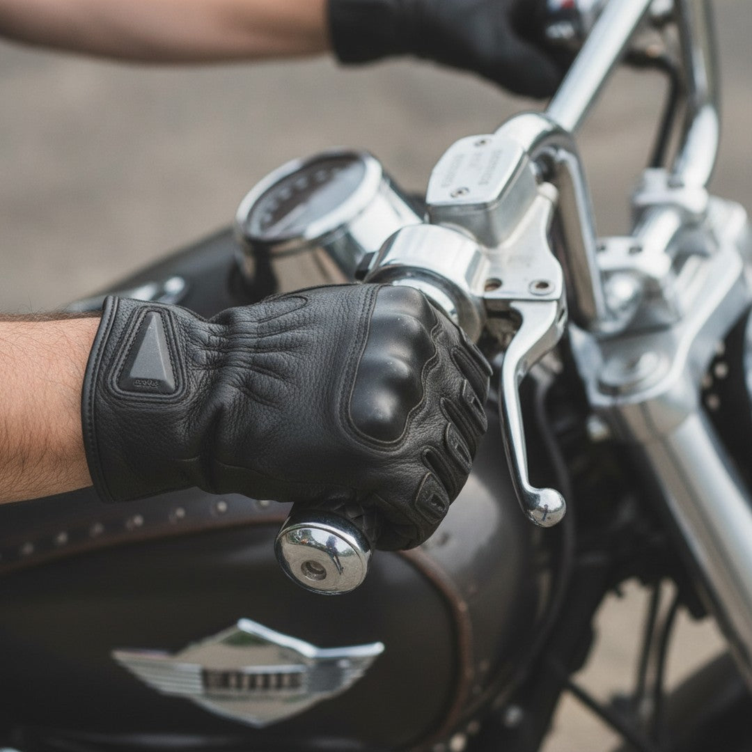 Hands in motorcycle gloves gripping handlebars