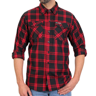 A man wearing the Hot Leathers Men's Red And Black Long Sleeve Flannel with rolled-up sleeves and blue jeans.