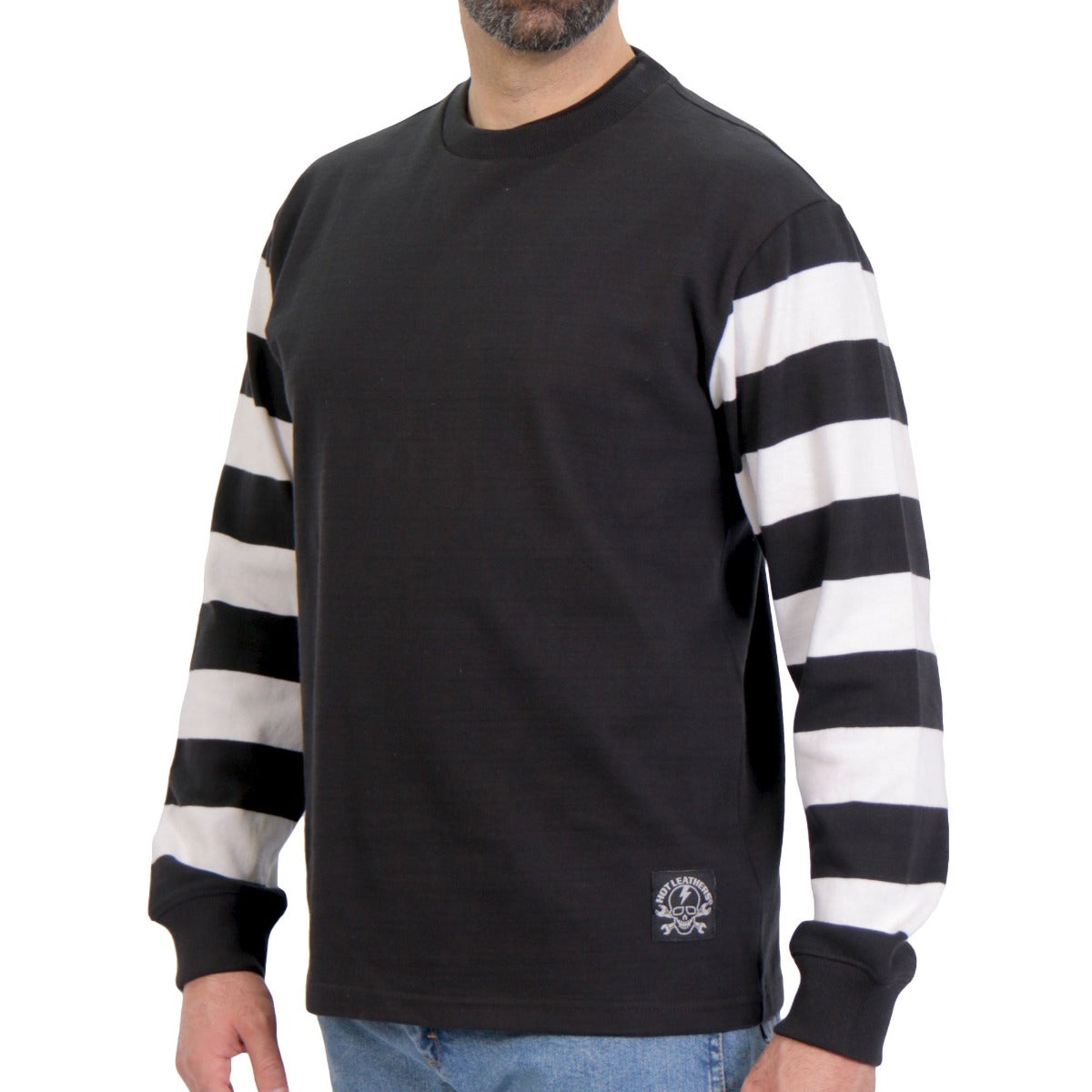 A man wearing the Hot Leathers Men's Striped Jersey Long Sleeve Shirt, featuring black and white striped sleeves and made from 100% cotton heavyweight fabric, stands against a plain background.