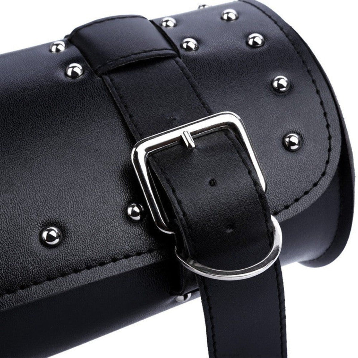 A black leather bag with studded straps, perfect as a Motorcycle Leather Duffle Roll Bag.