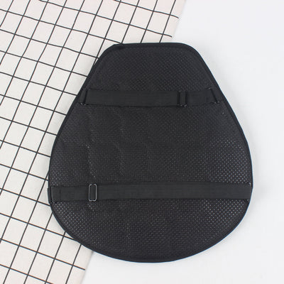 A black Motorcycle Seat Cushion Pad providing ventilation on top of a tiled floor.