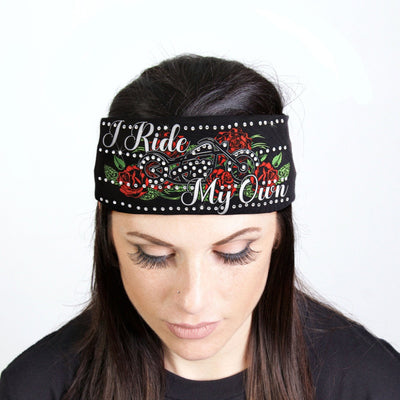 A woman rocking the Hot Leathers I Ride My Own Bandana Headband Wraps with Rhinestones and sparkle embellishments that says i ride my girl.
