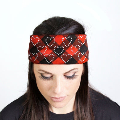 A woman wearing a Hot Leathers Plaid Red Bandana Headband Wraps w/Rhinestones in a biker style.