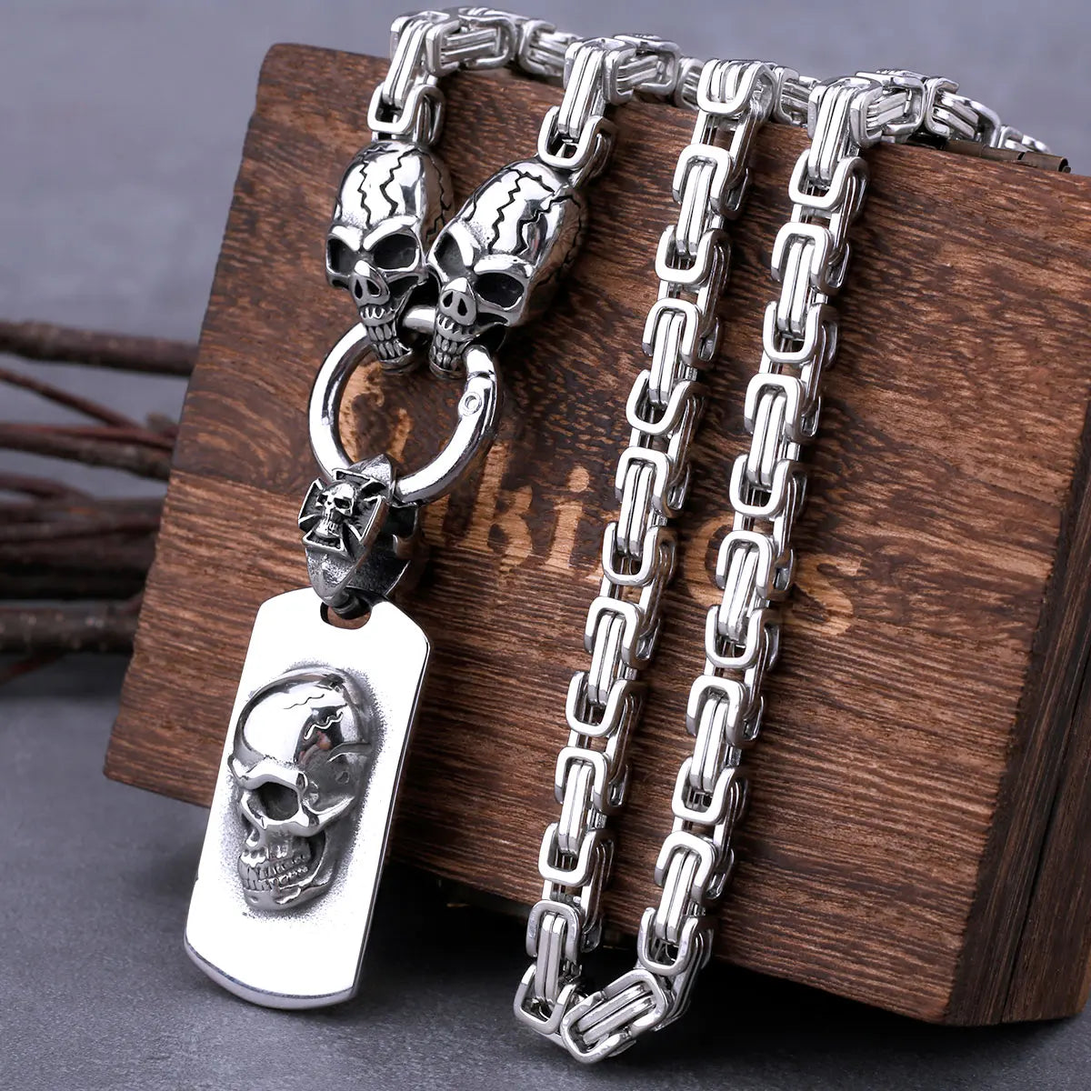 Displayed on a wooden box, the ALR™ Stainless Steel Pirate Skull Pendant Necklace blends vintage charm with modern flair. The silver stainless steel pendant adds an edgy touch to any outfit, perfect for those who dare to be different.