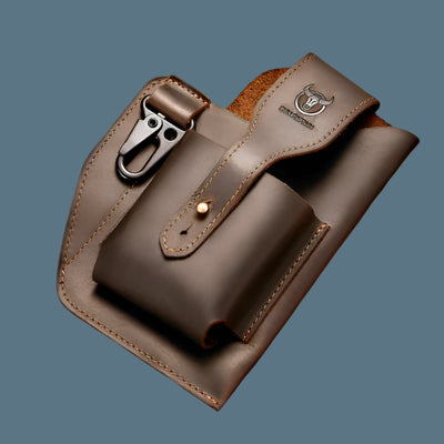 The ALR™ New Men's Leather Waist Bag combines rugged design with practicality, featuring a metal hook and buttoned flap. Stylish against a blue background, it's perfect for motorcycle riders seeking standout accessories.