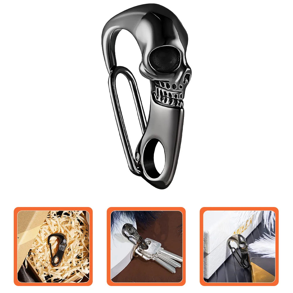 The ALR™ Skull Keychain Carabiner, showing its gothic-inspired stainless steel design, is displayed on shredded paper with keys and attached to a package.