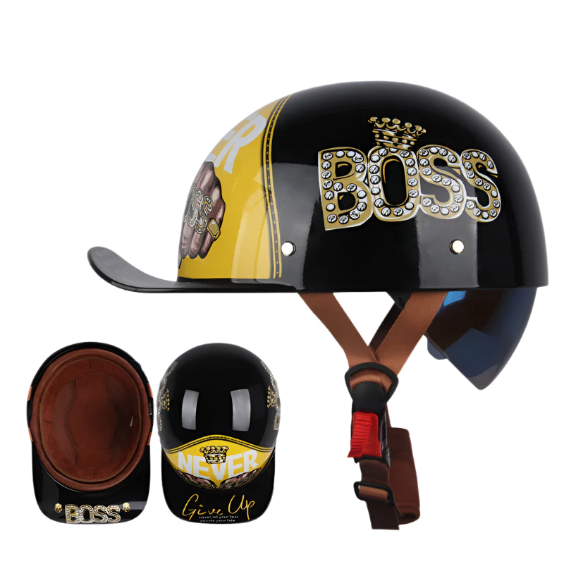 A glossy black helmet adorned with "BOSS" and crown graphics features a yellow section with "NEVER Give Up." Its vintage design, reminiscent of the ALR™ Baseball Cap Motorcycle Helmet, includes a brown interior lining for lightweight comfort and is shown from various angles.