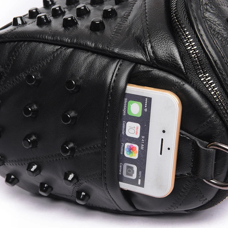 The ALR™ Luxury Women’s Genuine Leather Bag showcases studded detailing and designer craftsmanship, with a smartphone partially visible in an outer pocket.