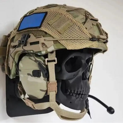 The Alr™ 3D Skull Motorcycle Helmet Display Rack presents a tactical helmet adorned with a camouflage pattern, mounted on a sleek black skull model. It includes a microphone and a blue patch, giving it an edgy yet functional appearance similar to that of the original motorcycle helmet skull rack.