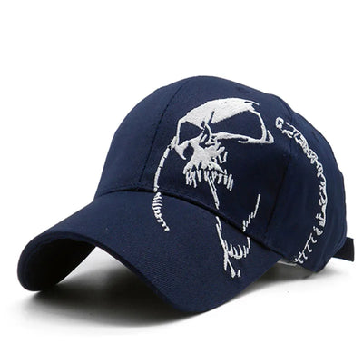 The ALR™ Embroidered Skull Cap in navy blue merges style and sun protection, showcasing a bold white skull embroidery on the front and an adjustable strap for a perfect fit.