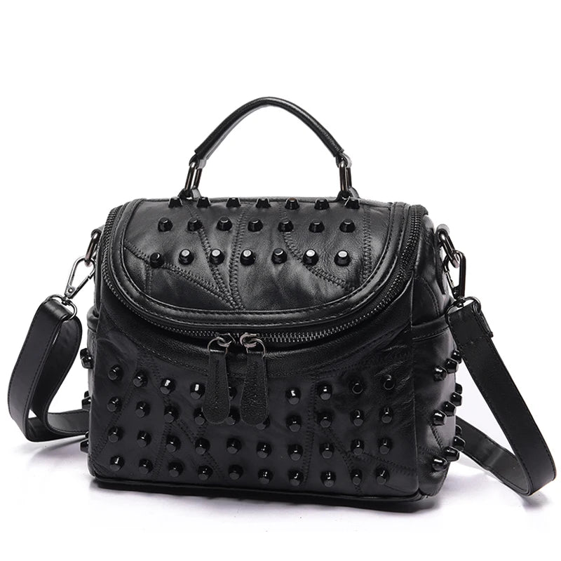 The ALR™ Luxury Women’s Genuine Leather Bag is crafted from premium sheepskin leather, featuring studded details, a top handle, detachable shoulder strap, zippered flap closure, and dual zip pulls, showcasing designer-level craftsmanship.