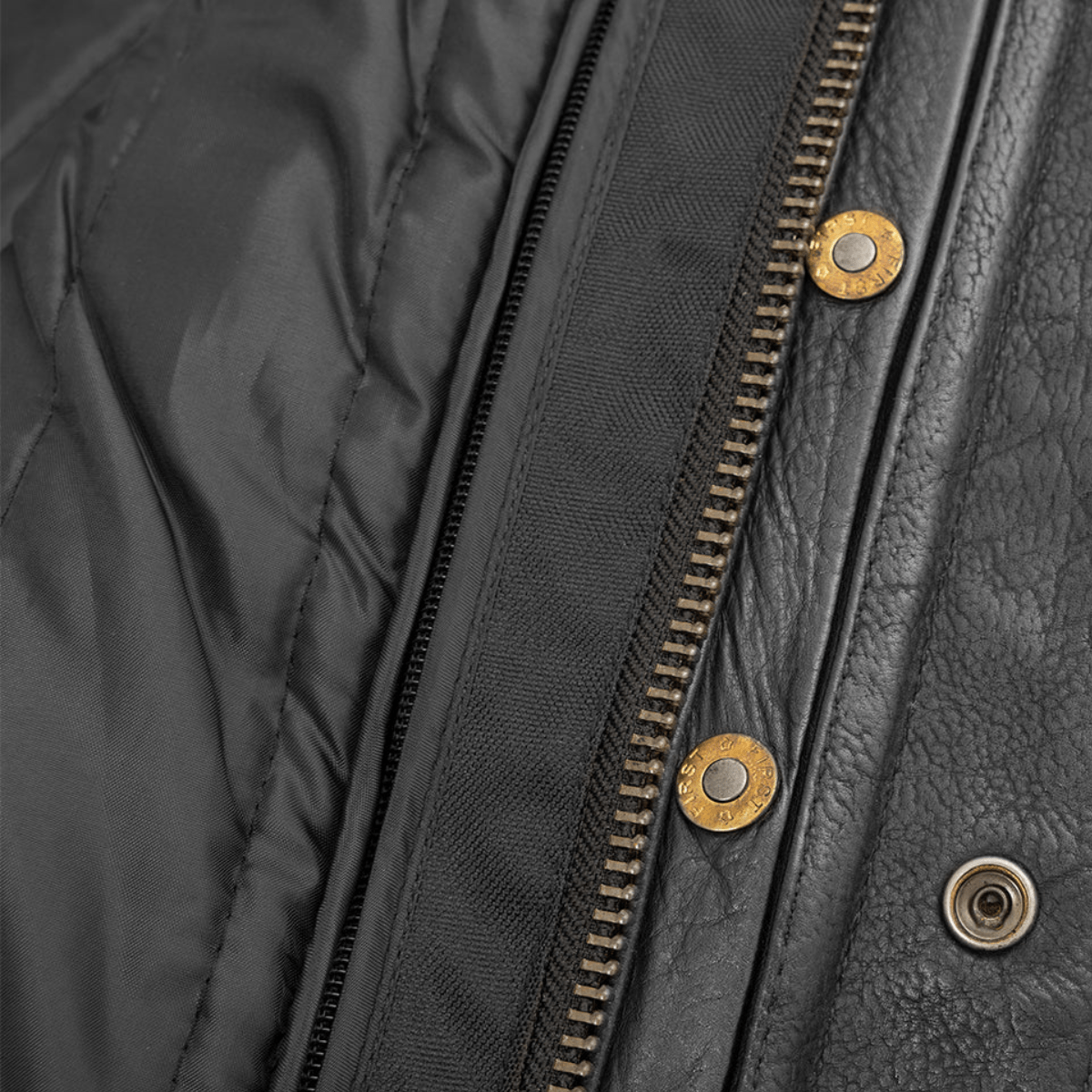 A close up of a high-quality leather zipper on the First Manufacturing Raider Leather Jacket.