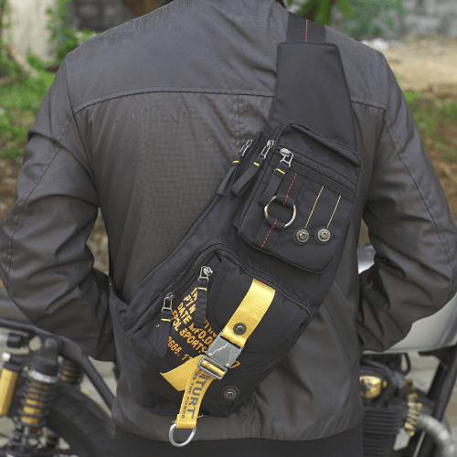 Sling bag worn on the back over a riding jacket