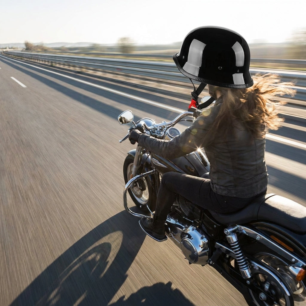 Rider wearing the German half helmet at speed on an open highway