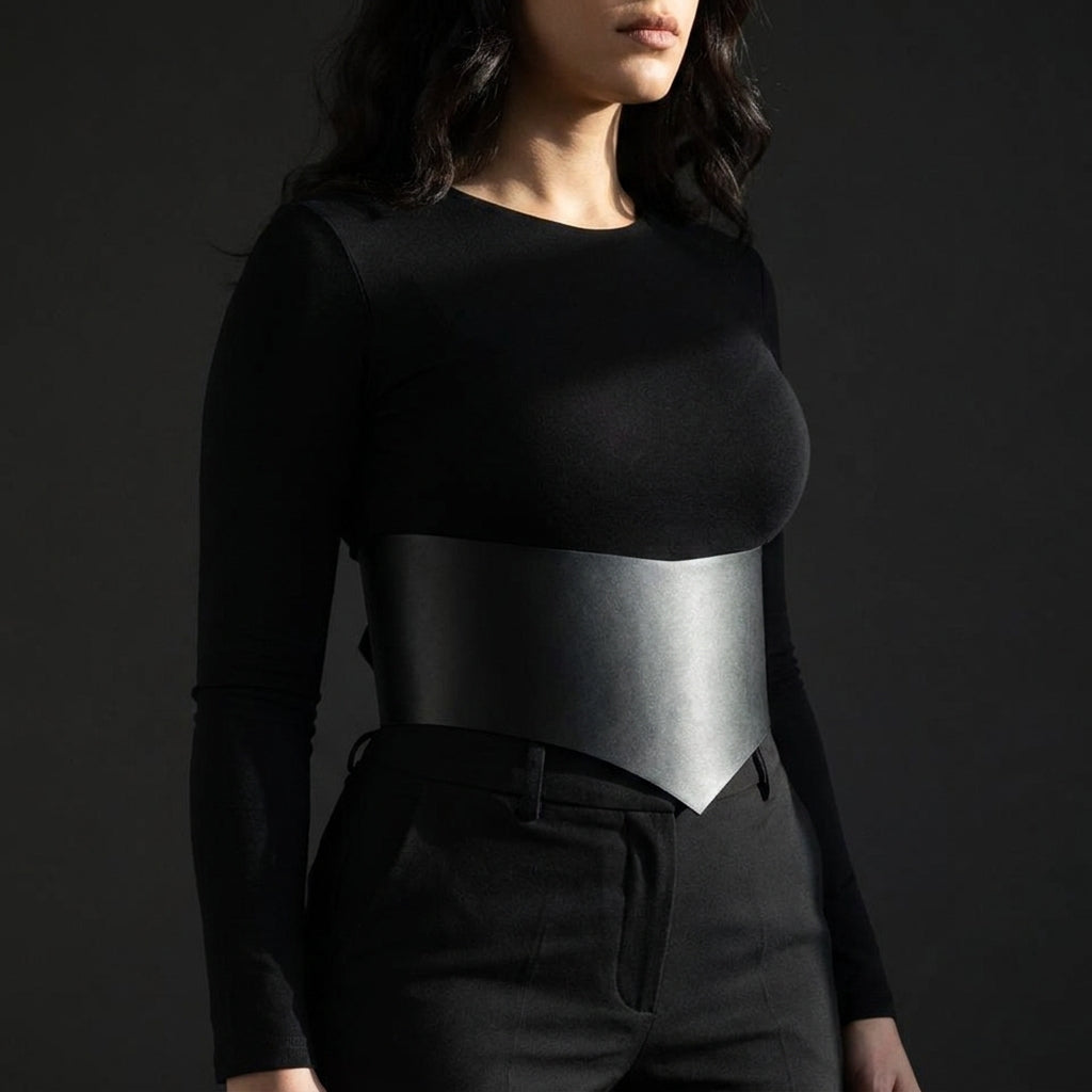 Studio shot showing the matte finish and crisp V edge of the wide corset waist belt