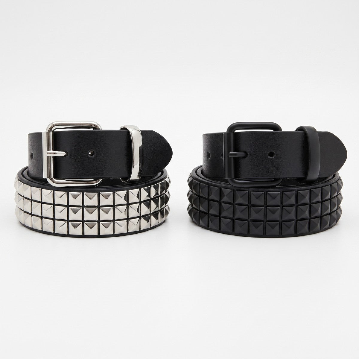Silver stud and black stud versions of the pyramid studded belt side by side