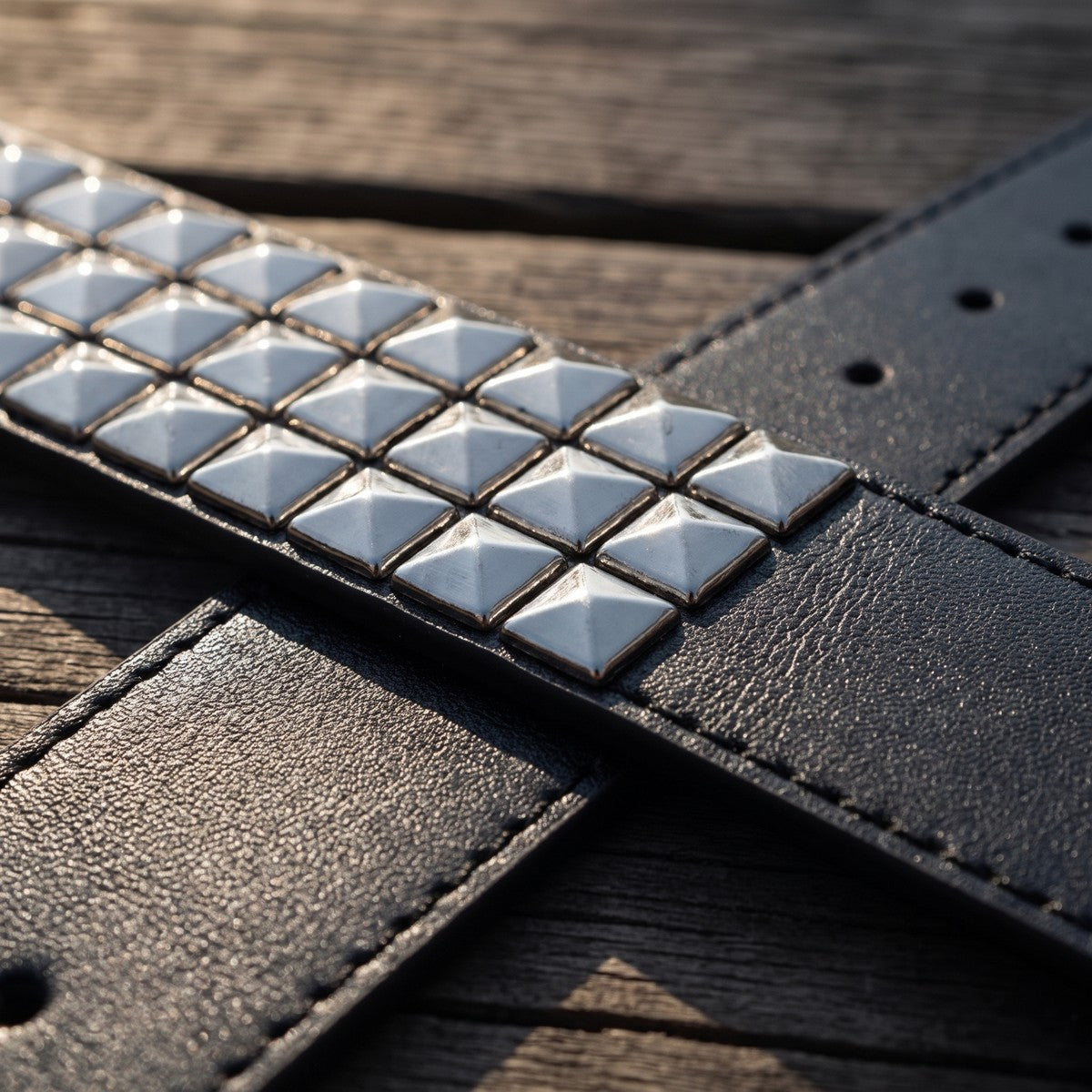 Close up of the three rows of flat square pyramid studs on the black belt