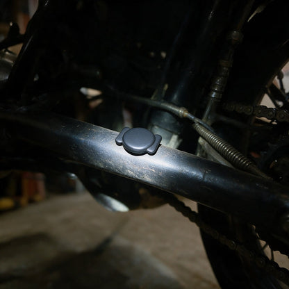 Bluetooth finder tag held magnetically to the frame under a motorcycle