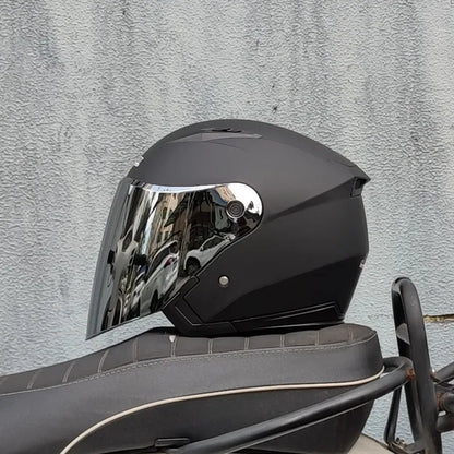 Dual lens motorcycle half helmet in matte black with built in flip down mirrored sun visor