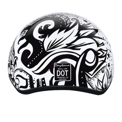 A black and white motorcycle helmet featuring an intricate abstract design with floral and swirl elements, crafted with a Slim Line Design for a sleek look. The back of the helmet shows a "Daytona D.O.T Skull Cap - w/Lovesee Helmet" label, ensuring it meets D.O.T. Safety Standards.