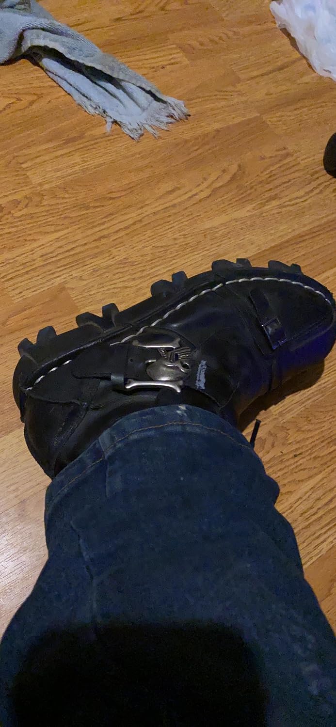 Customer wearing Iron Reign boot with jeans on wood floor