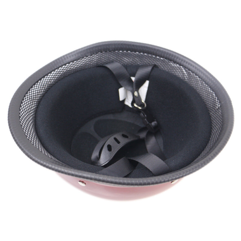 A durable Glossy Red German Motorcycle Helmet with a black mesh and a black strap.